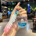 Portachiavi creativo a forma di sveglia con sabbie mobili liquide, coniglio blu e stelle. - Blu