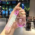 Portachiavi creativo rosa a forma di sveglia liquida con stelle e cinturino Bubble - Viola