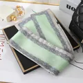 Close-up of mint green double-layered silk scarf with elegant grey paisley border - L040-09-01 Blue And White Porcelain Edge - Fruit Green