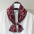 Detail of retro wine red skinny scarf with white horseshoe pattern tied in a bow - Wine-red Entanglement / 10*100cm