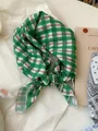 Close-up of a green checkered cotton linen square scarf with small floral patterns - 04 Green Grid