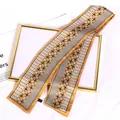 Close-up detail of vintage floral pattern on long silk-like French hair ribbon scarf - Brown-toned Floral Patterns / 10*100cm