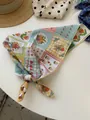 Close-up of cotton linen bandana with vintage floral and plaid patchwork design - 11-piece Puzzle