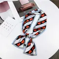 Detailed shot of a French vintage striped silk scarf featuring a vibrant red heart pattern - Red Heart Pattern / 10*100cm