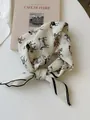 Macro view showing the soft texture and retro horse pattern of a cotton linen neckerchief - 16 Little Pony