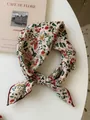 Close-up detail of cotton linen floral print square scarf with a vintage knotted style - 17 Full Flower Rice Base With Red Edge