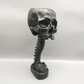 Matte black gothic skull planter featuring a unique spine stand base for home decor - 28.5cm / Black