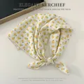 Elegant cream white square cotton linen scarf featuring a yellow floral pattern print - Small Yellow Flower