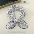 Elegant cotton linen square scarf with blue leaf print knotted for fashion styling - White Leaves