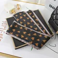 Elegant black satin twilly scarf featuring a gold heart pattern for hair accessories - L040-18-05 Heart-black