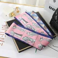 Elegant pink silk twilly scarf featuring horse head sketches with a deep blue border detail - L040-06-01 Giraffe - Pink