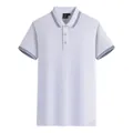 Polo en coton mercerisé blanc avec rayures bleues contrastées au col et aux manches courtes. - S / Hauts / Blanc