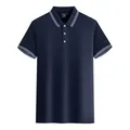 Élégant polo bleu marine en coton mercerisé avec col et bords de manches rayés. - S / Hauts / Bleu marine
