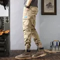 Side view showing details of khaki vintage washed cargo jogger pants with multiple pockets - 28 / Bottoms / Khaki