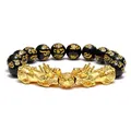 Close-up of golden Pixiu and obsidian beads with engraved six-syllable mantra - Style 1 / 12mm
