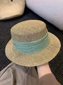 Detailed macro shot showing the fine weave texture of a flat-top straw hat with green band - M (56-58cm) / Light Green