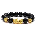 Close-up of black obsidian bead bracelet with intricate golden Pixiu charm - Style 9 / 12mm
