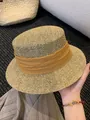 Detailed close-up of a French flat-top straw hat featuring a mustard yellow fabric band - M (56-58cm) / Orange