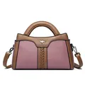 Elegante Handtasche aus pinkem und braunem Leder mit geflochtenem Detail. - Lila