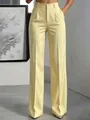 Detail view of high-waist yellow striped wide-leg trousers for a stylish commuter look - XS / Bottoms / Light Yellow