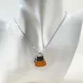 Halloween black cat in pumpkin pendant necklace on silver chain for festive wear - Silver
