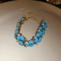 Bracelet vintage en turquoise et perles avec finition dorée antique pour femmes chic - Bracelet