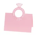 Detail of pink laser-cut diamond ring design on a foldable wedding table place card - Pink