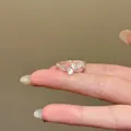 Minimalist silver-toned adjustable ring featuring zircon stones and cat eye opal accents - J898e Style