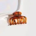 Elegant amber tortoiseshell octopus hair claw clip for women in golden brown - Cutout Leopard Claw Clip