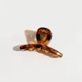 Elegant tortoiseshell hair claw clip with cross-loop design on white background - Cross Leopard Claw Clip
