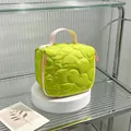 Detailed macro view of a green quilted flower cosmetic bag with a stylish pink handle - 14.5*8.5*14.5cm / Yellow-Green