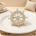 Elegant gold-plated ship wheel helm brooch with sparkling rhinestones, 3.5cm diameter - KC Gold Ship Wheel