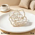Vintage gold-tone rose brooch with sparkling rhinestones for scarves and sweaters - Hollow Camellia / Gold