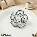Elegant silver-toned camellia flower brooch with sparkling rhinestones and pearl center - Enamel Camellia / Silver
