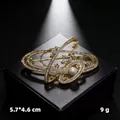 Elegant vintage gold star brooch with rhinestones and pearl detail on a gift box - KC Gold Planet