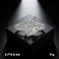 Elegant silver-tone star orbit brooch featuring a central pearl and tiny rhinestones - Silver Planet
