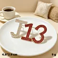 Elegant vintage 'JL3' brooch pin featuring red rhinestones and white pearls jewelry - Gold J13 Red Rhinestone