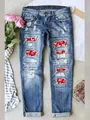 Detailed view of distressed denim jeans with festive red Christmas Ho Ho Ho patches. - Dark Blue HO Pattern