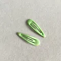 Durable pair of candy green snap hair clips with a smooth glossy oil drip finish - Apple Green