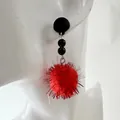 Festive red pom-pom drop earrings with black beads on a white mannequin stand - Red Fur Ball With Tinsel Black Bead Style (33350-ear-red-EP)
