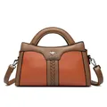 Elegante Handtasche aus orangefarbenem und braunem Leder mit verstellbarem Schultergurt - Gelb