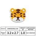Makrodetail eines Cartoon-Tiger-Stickaufnähers mit selbstklebender Rückseite und Größe - Tiger-Kopf-Stil (DW8980-2)