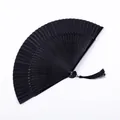 Elegant all-black lacquer Chinese style folding fan with a matching decorative tassel - S-Type Hollow Black Satin Face