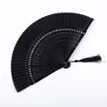 Classical all-black lacquered folding fan with elegant tassel detail - Snowflake Hollow Black Satin Face