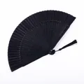 Abanico plegable negro lacado tradicional de estilo chino clásico con borla elegante - Tipo B Calado en Forma de S Cara Negra