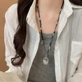 Minimalistische zilveren lange ketting met kristallen druppel en kruis hanger - Kruishanger / Zilver-Zwart