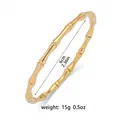 Detail view of a gold bamboo-shaped bangle showing 6cm inner diameter and 15g weight - Bamboo Joint Bangle (TT0092) / Gold