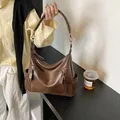 Large capacity brown hobo bag with double zipper detail for women's daily commute. - Brown