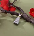 Handmade silver-grey mini rayon tassel pendant with gold wire wrap and 2cm length - Silver Gray