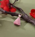 Premium 2cm pink mini rayon tassel pendant featuring a gold ring for DIY jewelry making - Peach Pink